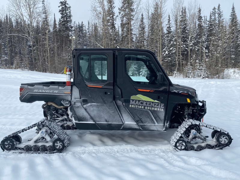 The photo depicts the District of Mackenzie owned ATV which will be used to provide rides to residents and visitors around the trails at the WinterQuest event coming up on February 21 - 23, 2025.